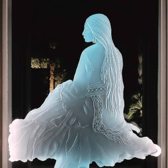 Etched glass panel of “Indian Maiden in traditional dress.  Panel is 42” x 70” with LED lighting to illuminate the figure. Job is in La Quinta, California